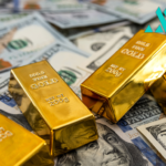 Gold Drops from Record Highs as Markets Brace for Trump’s Tariff Plan